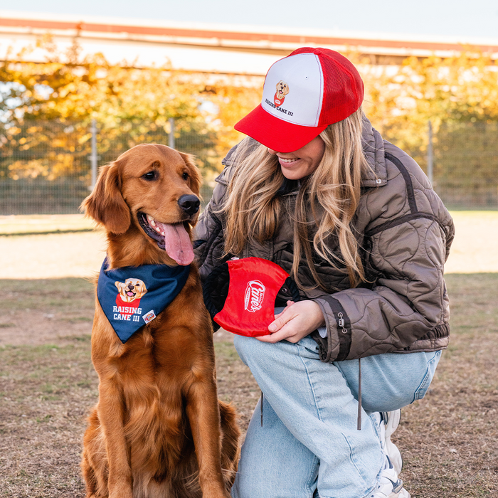 Cane III Trucker Hat on Model with Red Golden Retriever