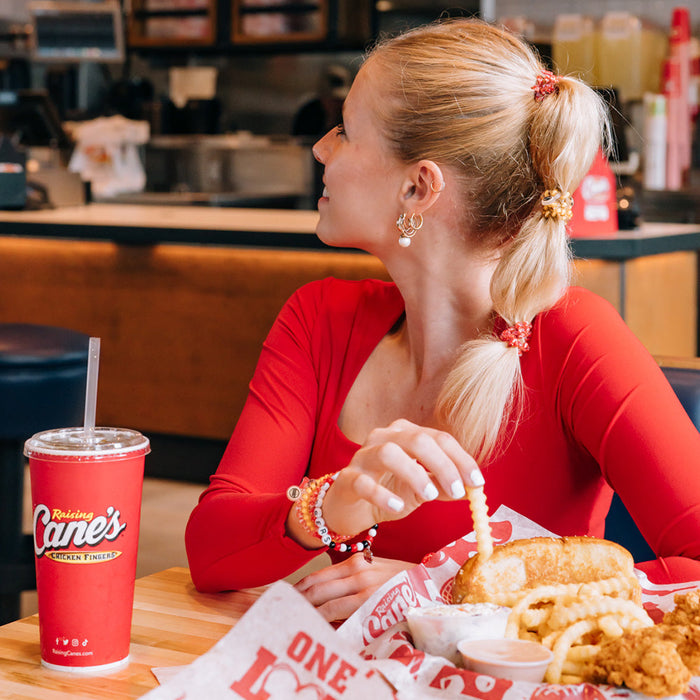 Raising Cane's TELETIES Set on Model's Wrist and Hair