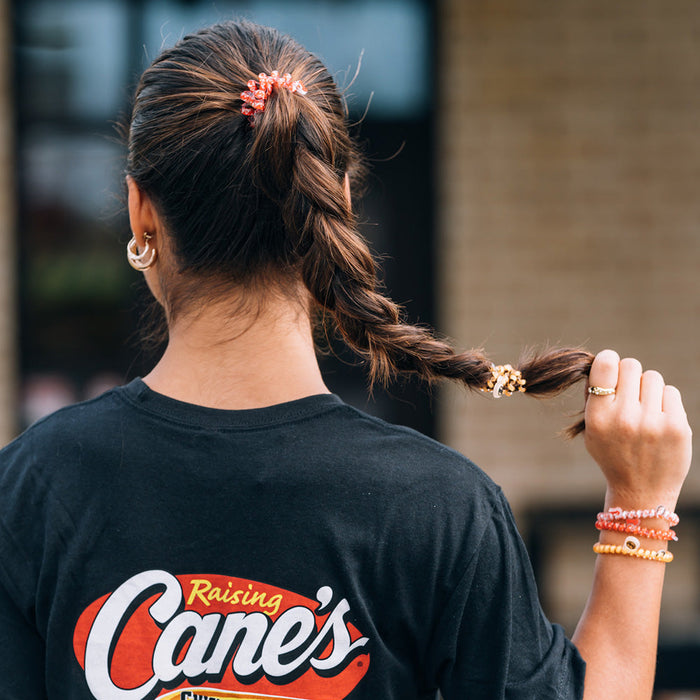 Raising Cane's TELETIES on Adult Model's Wrist and Hair