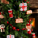 Decorative Christmas tree with various ornaments including lemonade cup, box combo, Cane's sauce, Texas toast, and Cane plush.