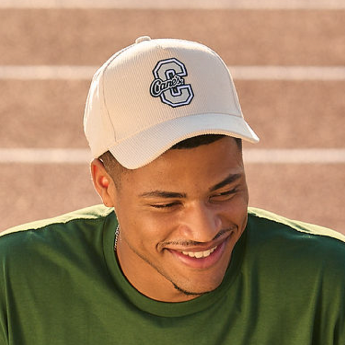 Model wearing Cane's Varsity Corduroy Hat in color Stone