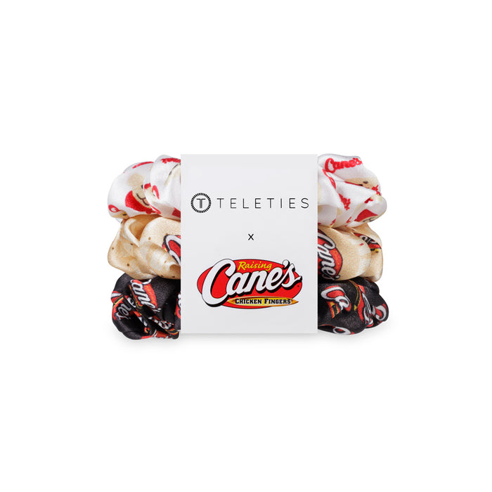 Three hair ties with 'TELETIES' and 'Raising Cane's' branding on a white background