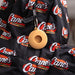 Back of Cane's Sauce Key Tag Holder on black Raising Cane's backpack