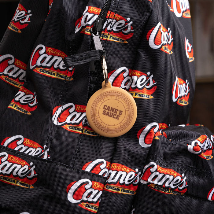 Cane's Sauce Key Tag Holder on black Raising Cane's backpack