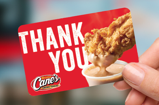 Hand holding red Thank You gift card