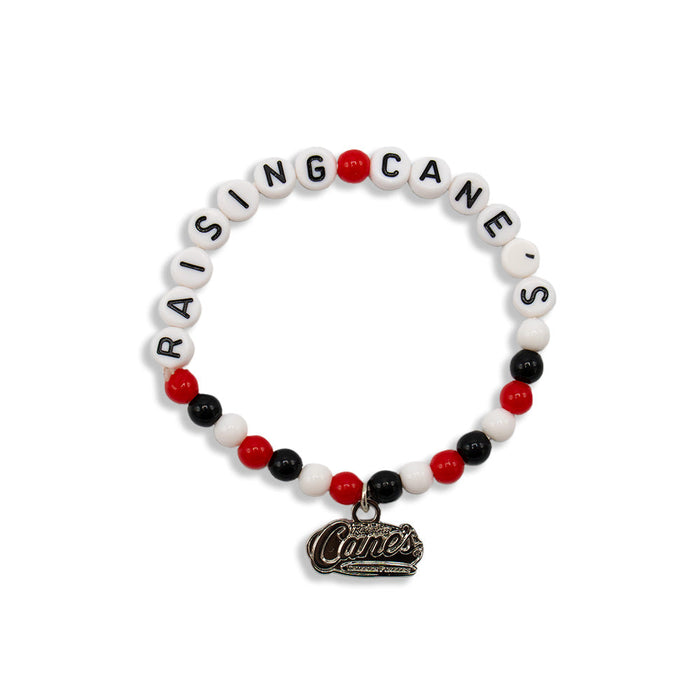 Beaded bracelet that says Raising Cane's with logo dangle charm